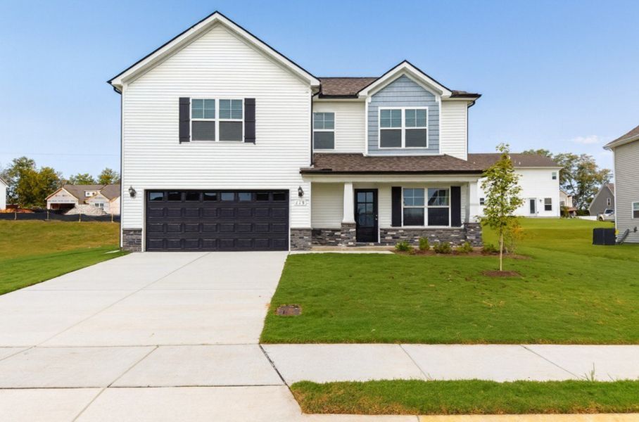 Front exterior of a new home in Wheatfield, Shelbyville, TN, highlighting curb appeal (Image 1). Front exterior of a new home in Wheatfield, Shelbyville, TN, highlighting curb appeal (Image 1).