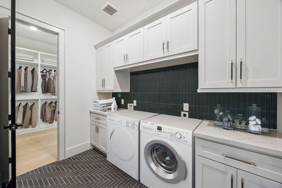 Laundry room is conveniently adjacent to primary closet Laundry room is conveniently adjacent to primary closet