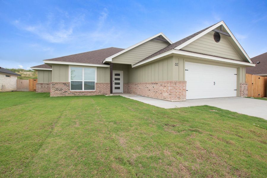 Front exterior of a new home in , Burnet, TX, highlighting curb appeal (Image 1). Front exterior of a new home in , Burnet, TX, highlighting curb appeal (Image 1).