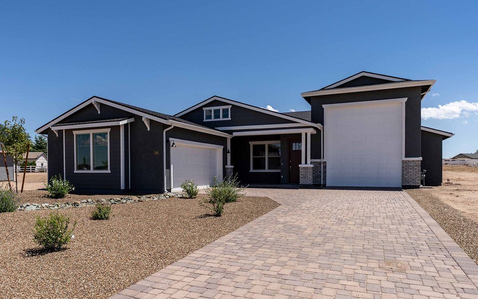 Front exterior of a new home in Heritage Pointe, Chino Valley, AZ, highlighting curb appeal (Image 1).