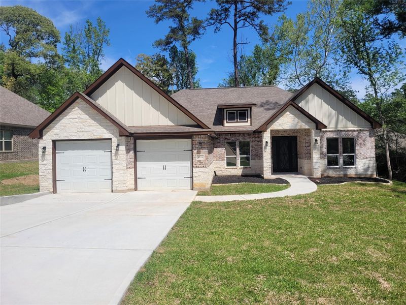 Another view of the brick and stone exterior. This is not the actual home, but a picture of a previously built home in the area. Another view of the brick and stone exterior. This is not the actual home, but a picture of a previously built home in the area.
