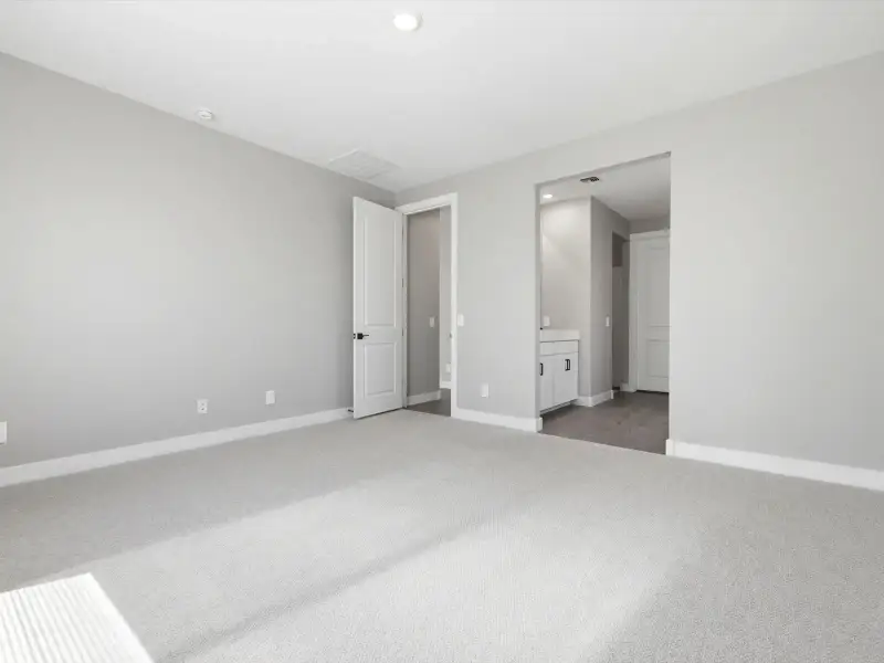 Spacious, unfurnished interior of a new home in Blossom Rock Reserve Series, Apache Junction (Image 15).