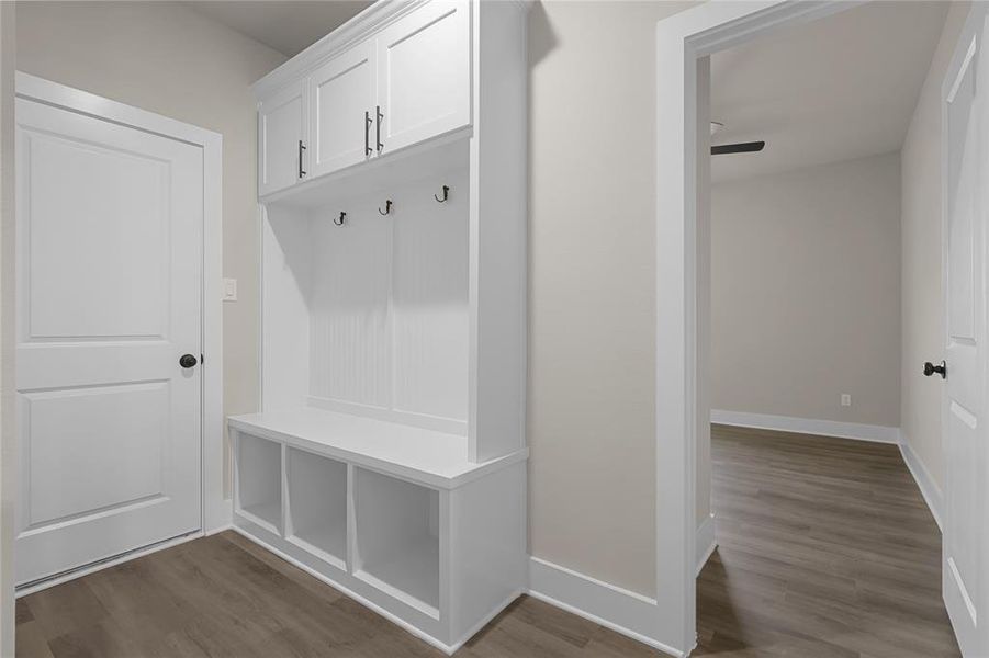 Mudroom with dark hardwood / wood-style flooring