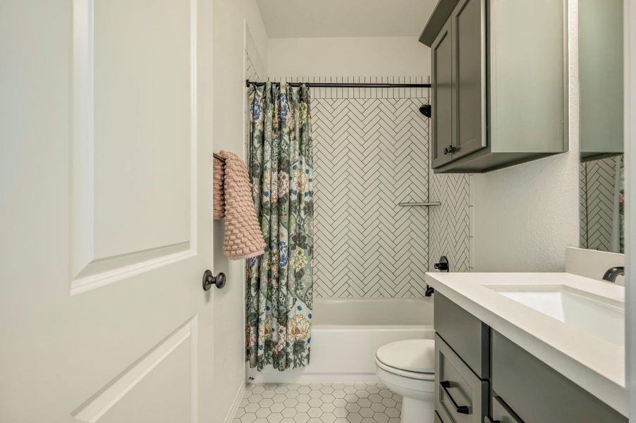 Secondary Bathroom with Designer Tile & Color Scheme