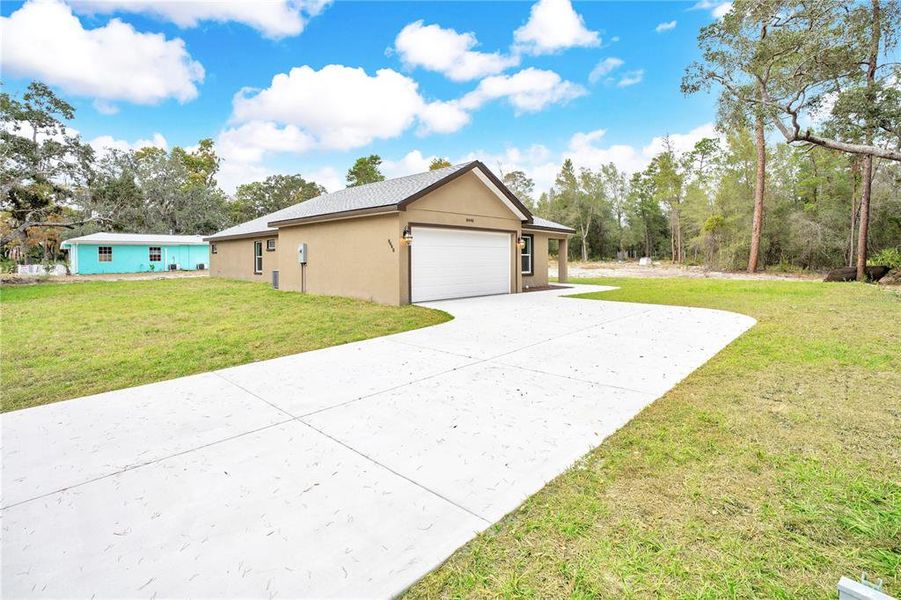 Front exterior of a new home in , Weeki Wachee, FL, highlighting curb appeal (Image 2). Front exterior of a new home in , Weeki Wachee, FL, highlighting curb appeal (Image 2).