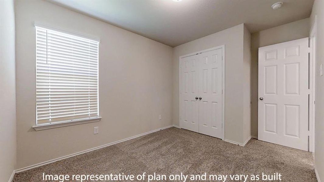 Unfurnished bedroom featuring carpet and a closet Unfurnished bedroom featuring carpet and a closet