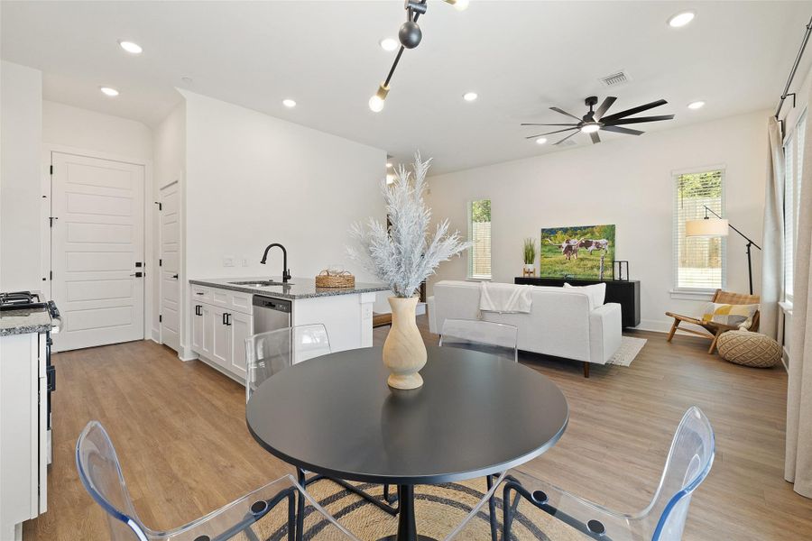 Dining area featuring light wood-style floors, recessed lighting, healthy amount of natural light, and a ceiling fan Dining area featuring light wood-style floors, recessed lighting, healthy amount of natural light, and a ceiling fan