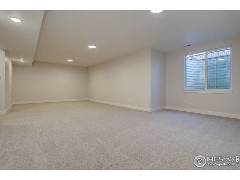 Exercise room? Media space? Office? This is a really nice basement space