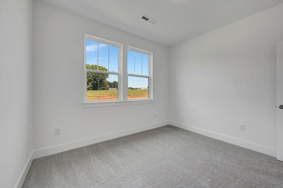 Spacious, unfurnished interior of a new home in McAlister Creek, Clayton (Image 24).