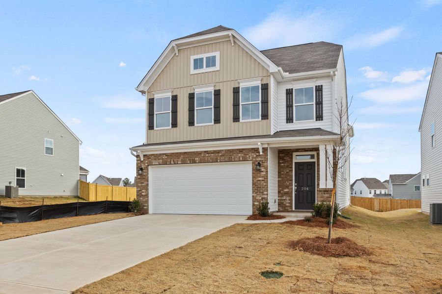 Front exterior of a new home in Harrington, Greenville, SC, highlighting curb appeal (Image 2). Front exterior of a new home in Harrington, Greenville, SC, highlighting curb appeal (Image 2).