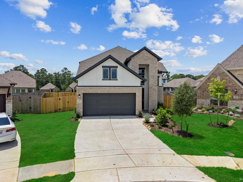 Front exterior of a new home in Escondido, Magnolia, TX, highlighting curb appeal (Image 22). Front exterior of a new home in Escondido, Magnolia, TX, highlighting curb appeal (Image 22).
