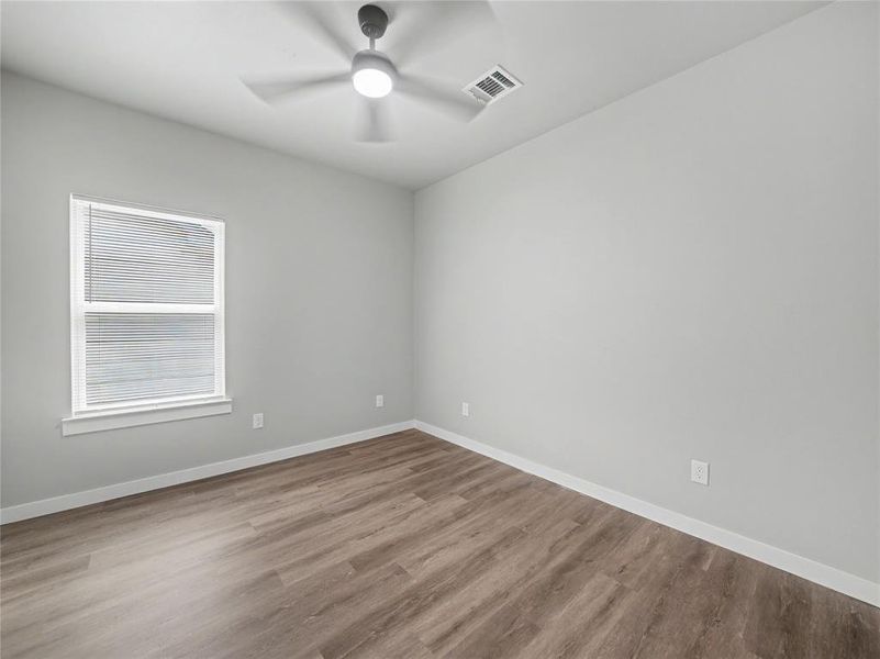 Neutral tone walls paired with wood-finish flooring Neutral tone walls paired with wood-finish flooring