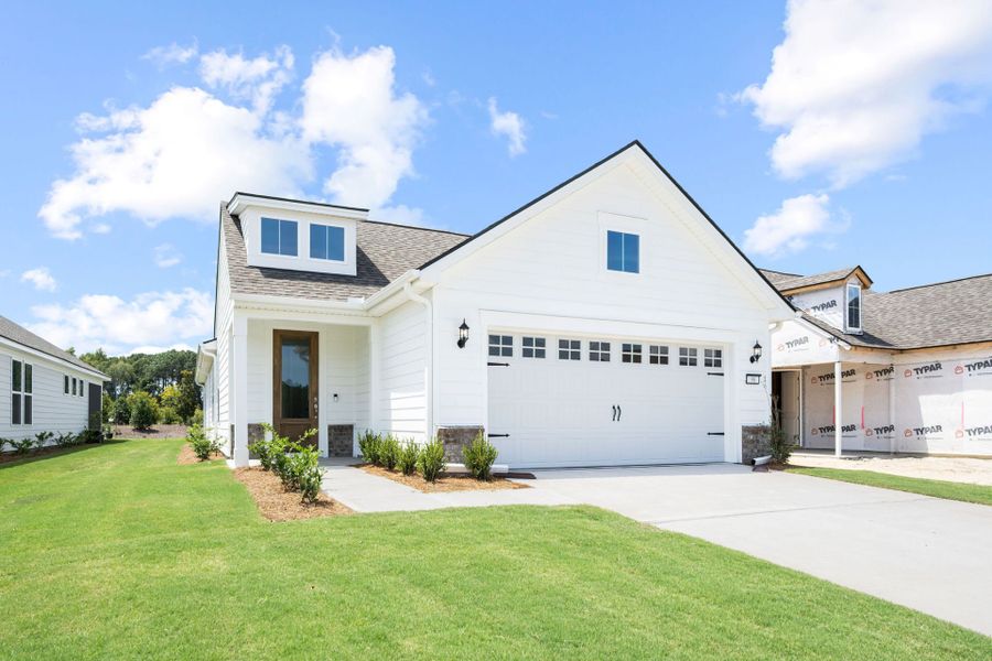 Front exterior of a new home in Del Webb Savannah at Heartwood, Richmond Hill, GA, highlighting curb appeal (Image 1). Front exterior of a new home in Del Webb Savannah at Heartwood, Richmond Hill, GA, highlighting curb appeal (Image 1).