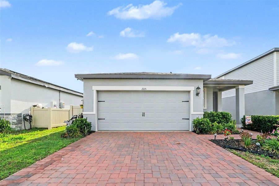Front exterior of a new home in Bradbury Creek - Classic Series, Haines City, FL, highlighting curb appeal (Image 23).