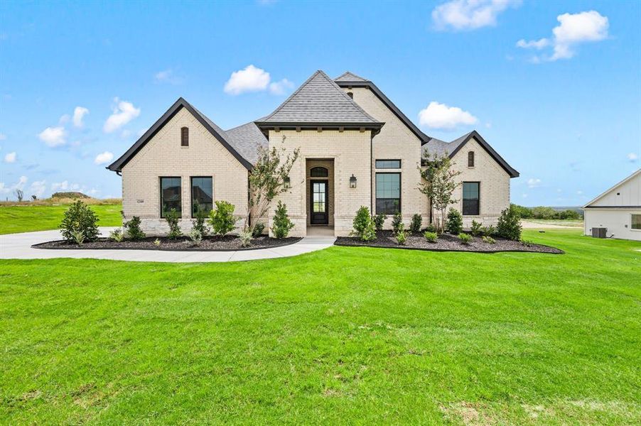 Front exterior of a new home in Bella Crossing, Fort Worth, TX, highlighting curb appeal (Image 22).