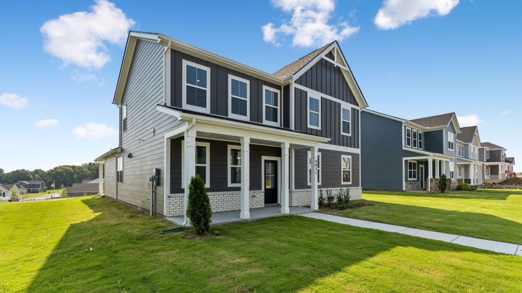 Front exterior of a new home in Reserve at Hickory Ridge, Columbia, TN, highlighting curb appeal (Image 27). Front exterior of a new home in Reserve at Hickory Ridge, Columbia, TN, highlighting curb appeal (Image 27).