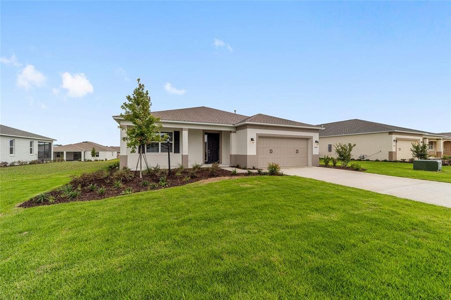Front exterior of a new home in , Ocala, FL, highlighting curb appeal (Image 2). Front exterior of a new home in , Ocala, FL, highlighting curb appeal (Image 2).