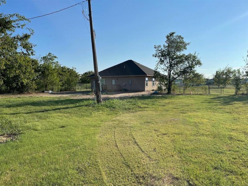 Front exterior of a new home in , Justin, TX, highlighting curb appeal (Image 13).