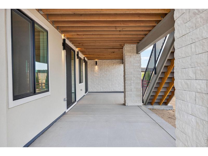 Exterior details and patio area of a home in RainDance, Windsor (Image 4).