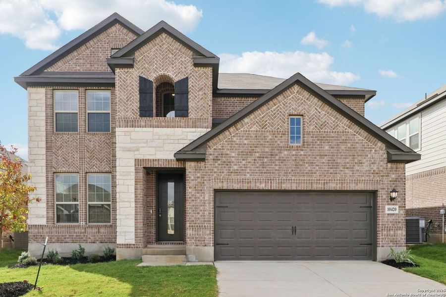 Front exterior of a new home in Fox Falls, Boerne, TX, highlighting curb appeal (Image 18). Front exterior of a new home in Fox Falls, Boerne, TX, highlighting curb appeal (Image 18).