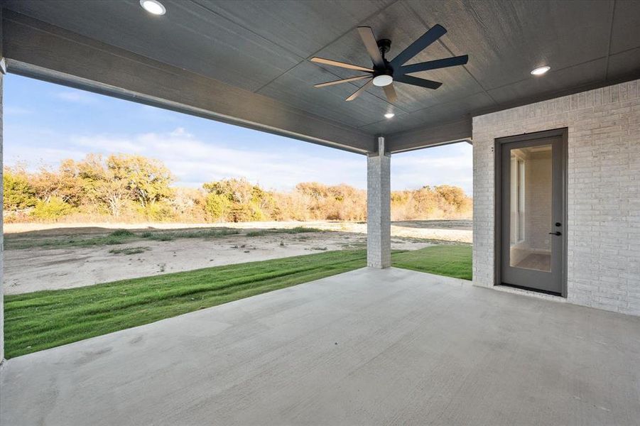 View of patio featuring ceiling fan