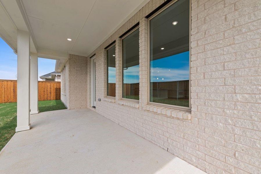 Exterior details and patio area of a home in Spiritas Ranch, Little Elm (Image 25).