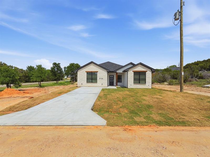 Front exterior of a new home in , Granbury, TX, highlighting curb appeal (Image 18).