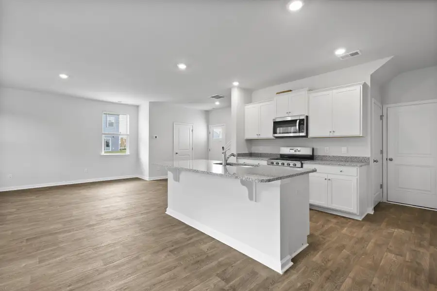 Furnished interior view inside a new home in Pine Hills at Cane Bay, Summerville (Image 2).