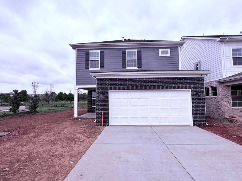 Front exterior of a new home in Promenade at Clari Park, Murfreesboro, TN, highlighting curb appeal (Image 18).