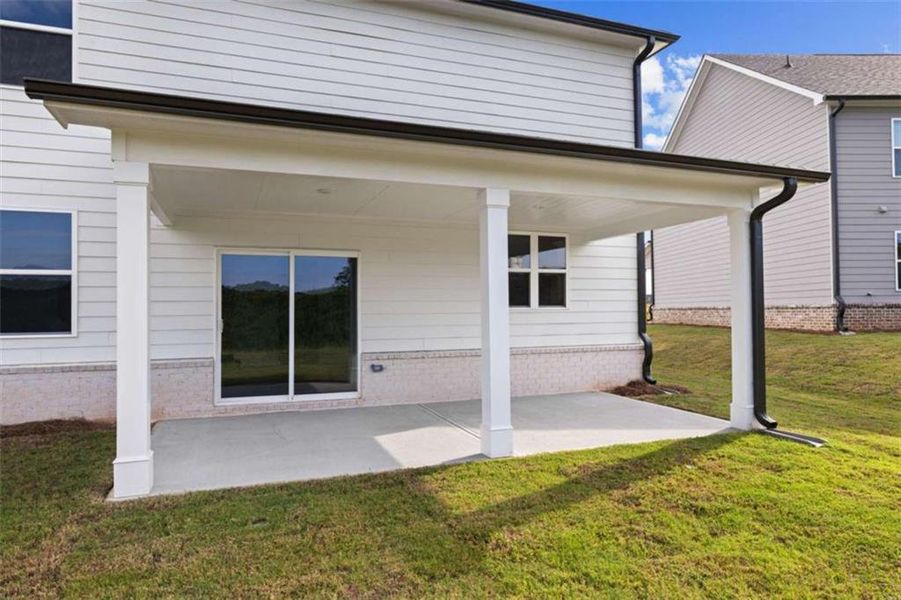 Exterior details and patio area of a home in The Estates at Gainesville Township, Gainesville (Image 11).