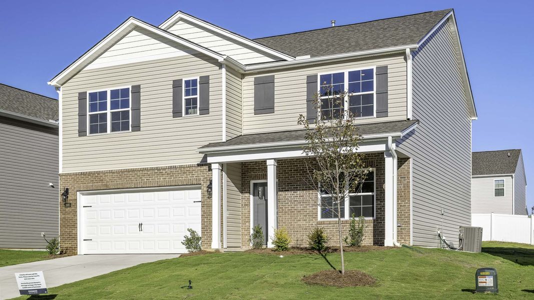 Front exterior of a new home in Cambridge Park, Mebane, NC, highlighting curb appeal (Image 2). Front exterior of a new home in Cambridge Park, Mebane, NC, highlighting curb appeal (Image 2).