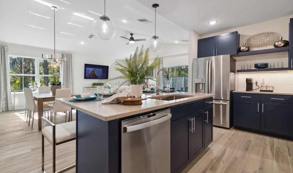 Stainless steel appliances and sink in kitchen