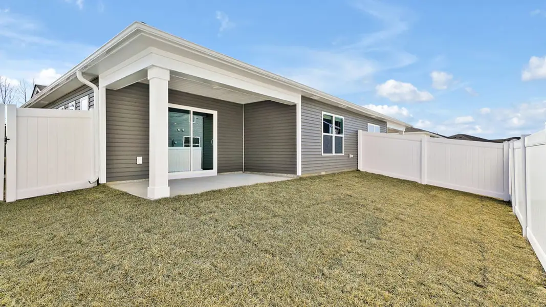 Exterior details and patio area of a home in Indigo Preserve Townhomes, Leland (Image 3).