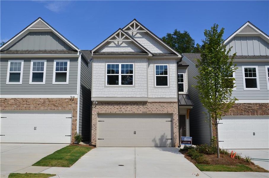 Front exterior of a new home in Owen Preserve, Canton, GA, highlighting curb appeal (Image 2). Front exterior of a new home in Owen Preserve, Canton, GA, highlighting curb appeal (Image 2).