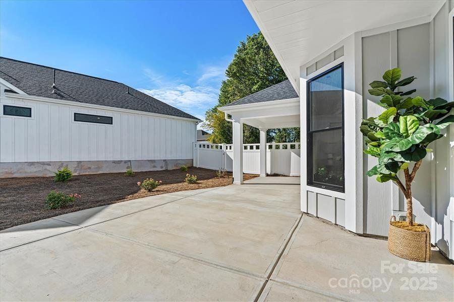 Exterior details and patio area of a home in The Courtyards at Lake Davidson, Mooresville (Image 22).