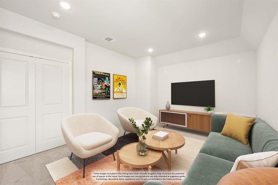 Casual living room with green sectional sofa, two white chairs, round coffee table, and wall-mounted TV on wood media console Casual living room with green sectional sofa, two white chairs, round coffee table, and wall-mounted TV on wood media console