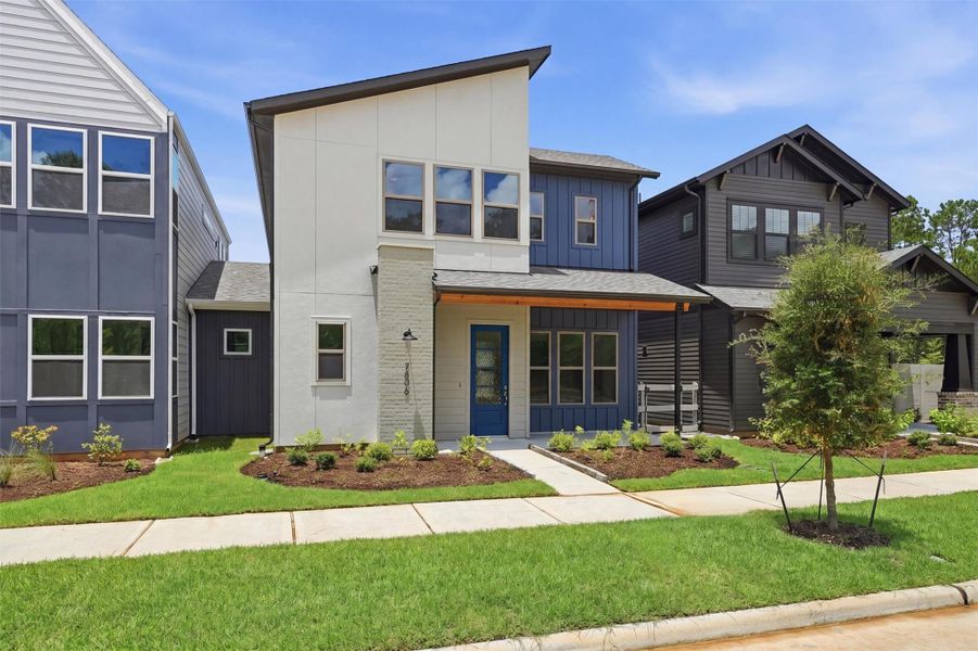 Front exterior of a new home in Two Step Farm, Montgomery, TX, highlighting curb appeal (Image 2). Front exterior of a new home in Two Step Farm, Montgomery, TX, highlighting curb appeal (Image 2).