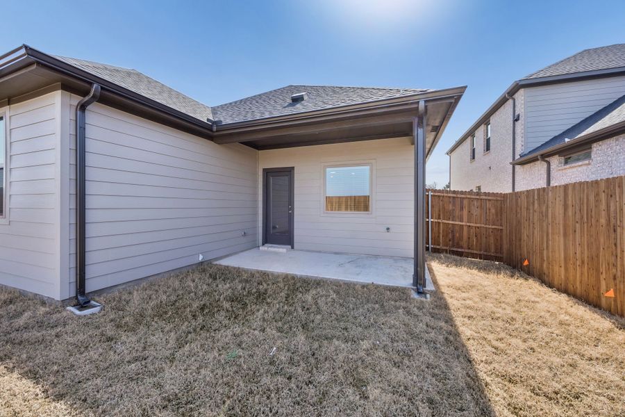 Covered Patio in the Oak II home plan by Trophy Signature Homes – REPRESENTATIVE PHOTO