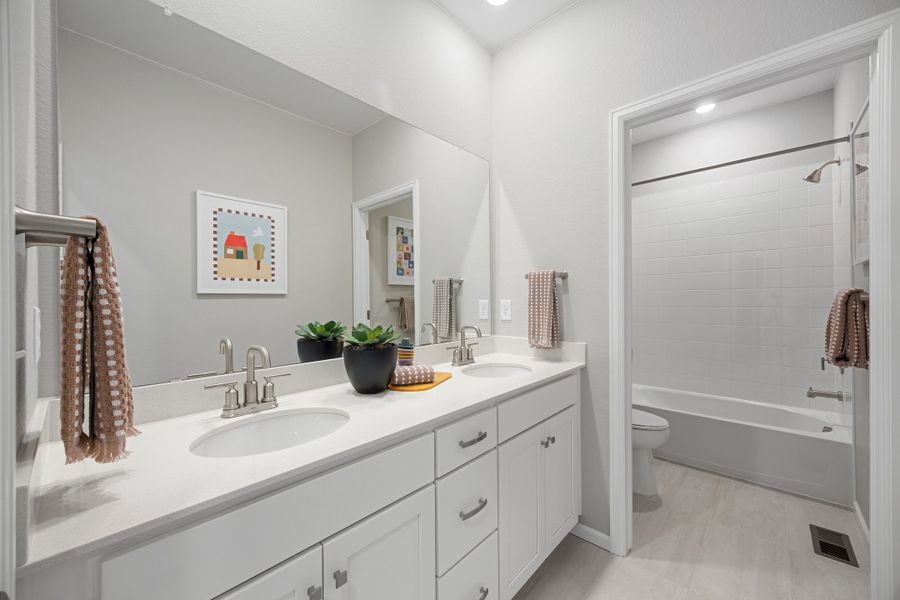 Representative furnished interior of a home built from the 2504 by Risewell Homes in Harvest Crossing, Aurora (Image 18).
