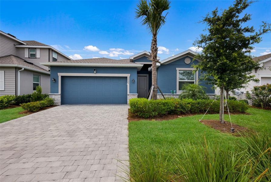 Front exterior of a new home in Rye Ranch, Parrish, FL, highlighting curb appeal (Image 22).