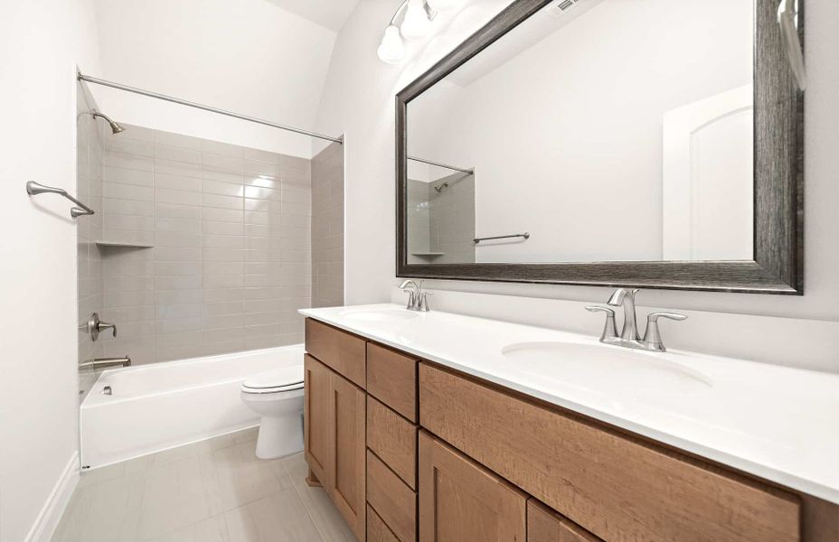 Representative furnished interior of a home built from the 4094 by Ravenna Homes in Artavia 70′, Conroe (Image 36).