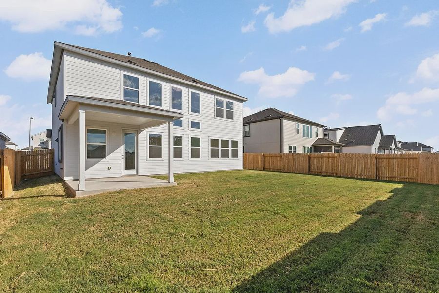 Exterior details and patio area of a home in Enclave at Cele, Pflugerville (Image 4).