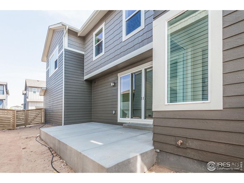 Exterior details and patio area of a home in Trailside Story Collection - Single Family Homes, Timnath (Image 21).