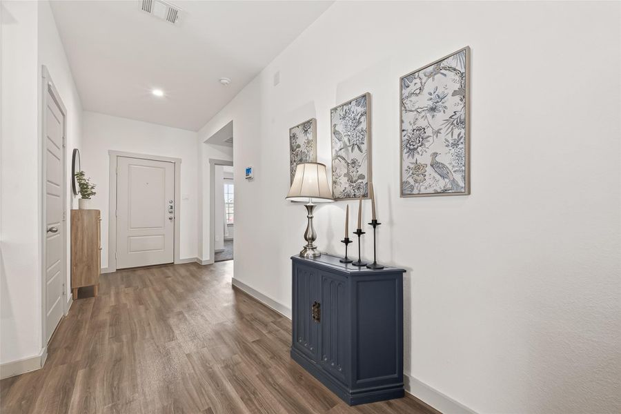 Inviting entryway garage door to the left, secondary bedroom straight ahead. Inviting entryway garage door to the left, secondary bedroom straight ahead.