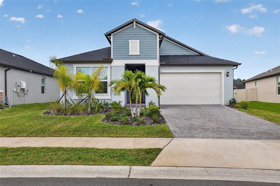 Front exterior of a new home in Stonegate Preserve, Palmetto, FL, highlighting curb appeal (Image 22).