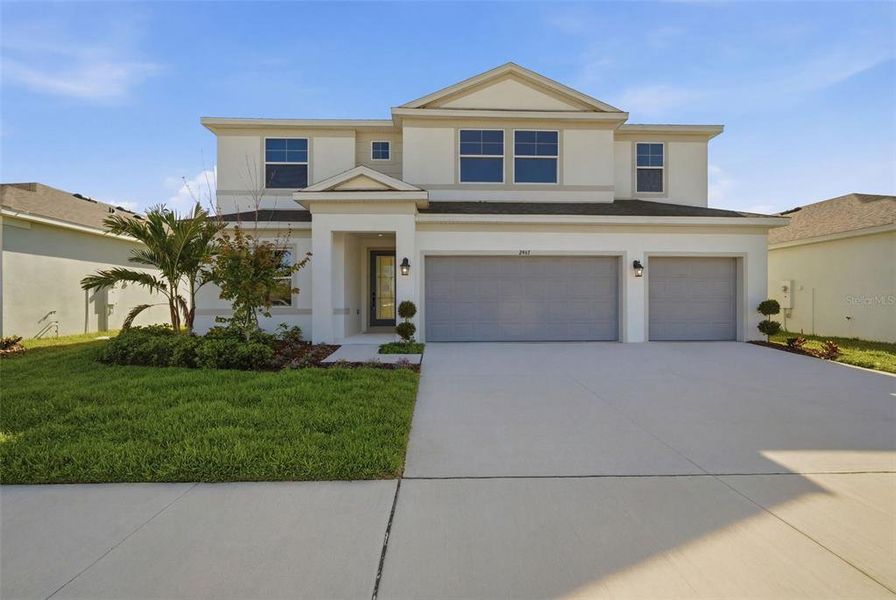Front exterior of a new home in Fieldstone, Plant City, FL, highlighting curb appeal (Image 28).