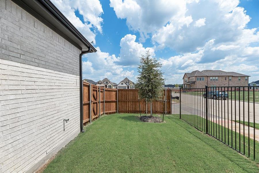 Exterior details and patio area of a home in Cottages of Celina, Celina (Image 23).