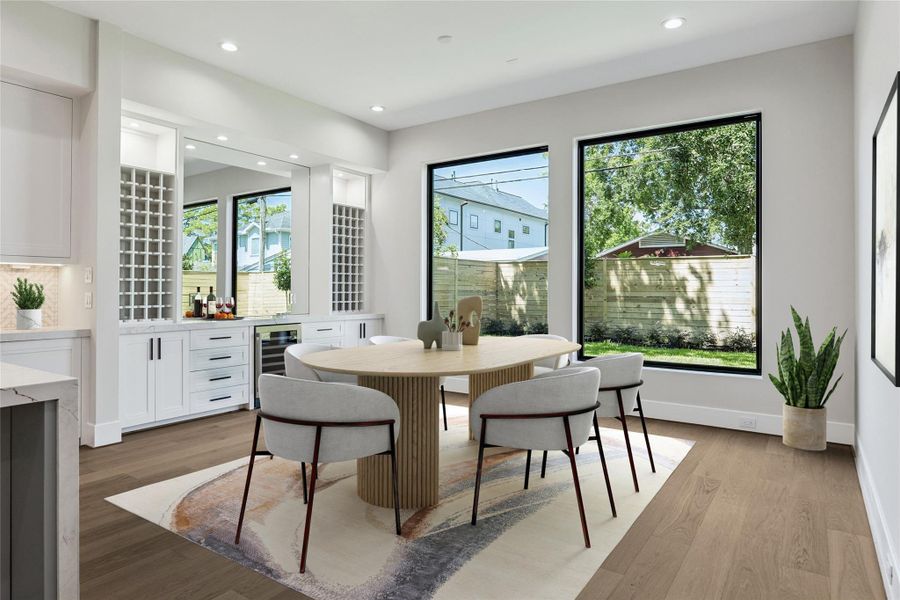 Virtually Staged. The dining room is designed for hosting lavish dinners and special occasions, with ample space to accommodate a large dining table and chairs. The buffet area is both stylish and functional, offering dedicated wine storage, ample drawer and cabinet space for organization, and a built-in beverage cooler for convenience. Virtually Staged. The dining room is designed for hosting lavish dinners and special occasions, with ample space to accommodate a large dining table and chairs. The buffet area is both stylish and functional, offering dedicated wine storage, ample drawer and cabinet space for organization, and a built-in beverage cooler for convenience.