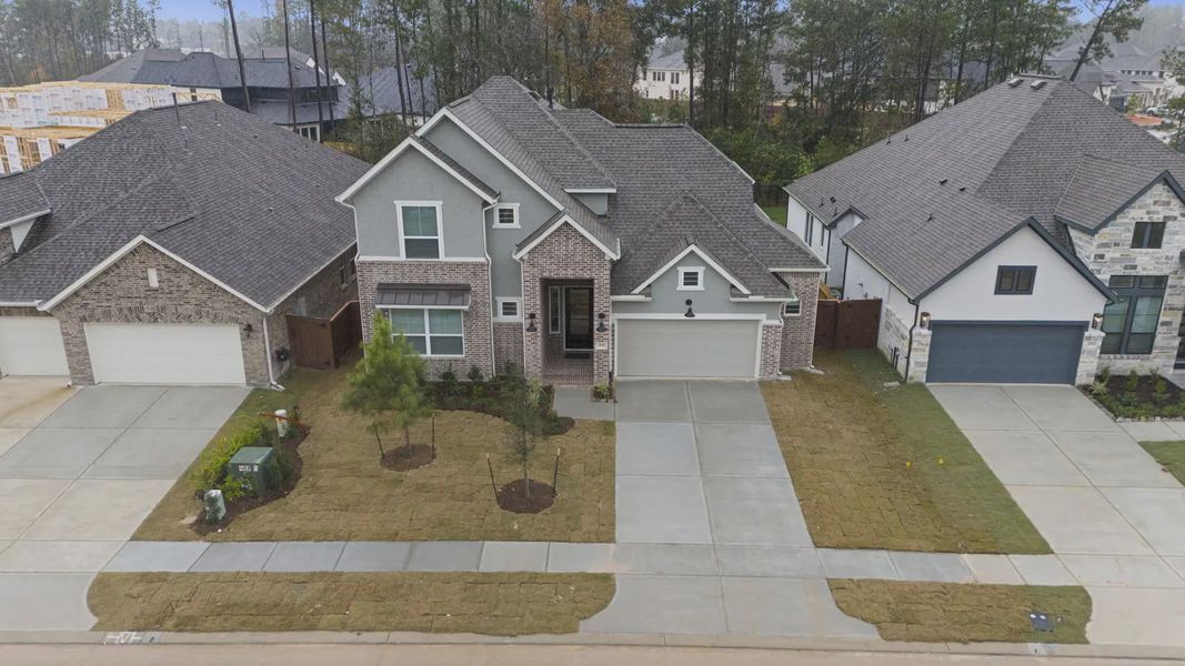 Front exterior of a new home in Evergreen, Fulshear, TX, highlighting curb appeal (Image 24).