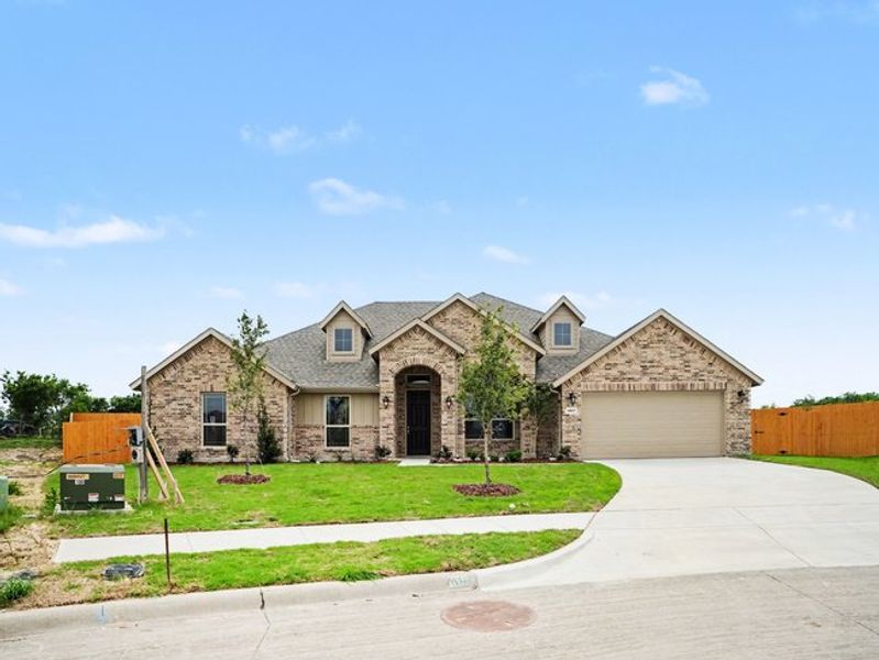 Front exterior of a new home in Cole Crossing Estates, DeSoto, TX, highlighting curb appeal (Image 2). Front exterior of a new home in Cole Crossing Estates, DeSoto, TX, highlighting curb appeal (Image 2).